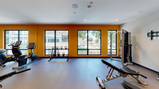 Fitness center with large windows and fitness machines